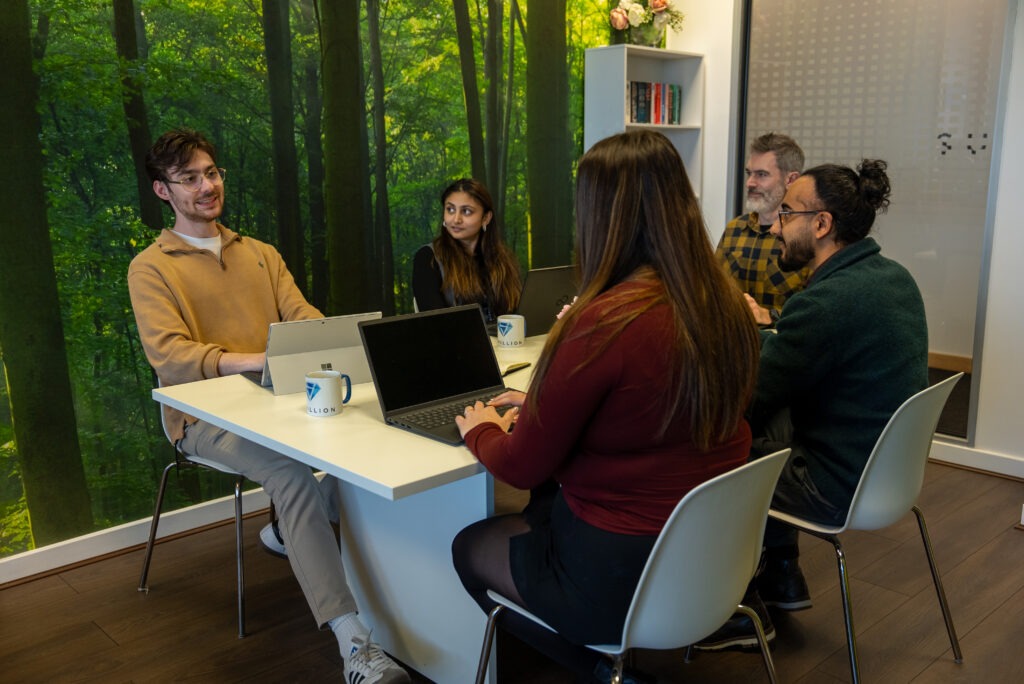 alt="Sustainability discussion with team"